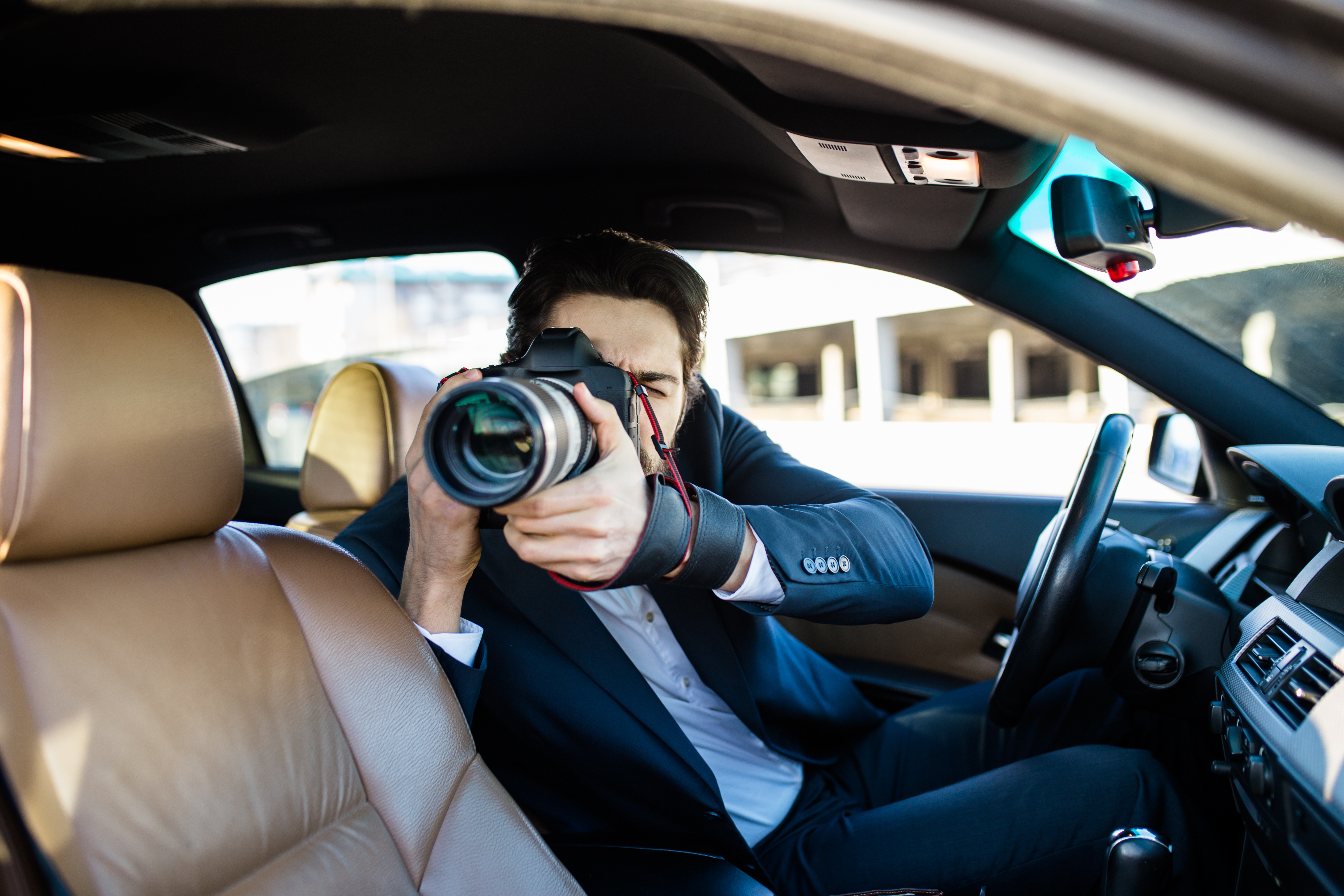 image of Private Detective Taking Photos Of Man And Woman